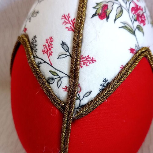 Geometric decorative egg used, red and floral design