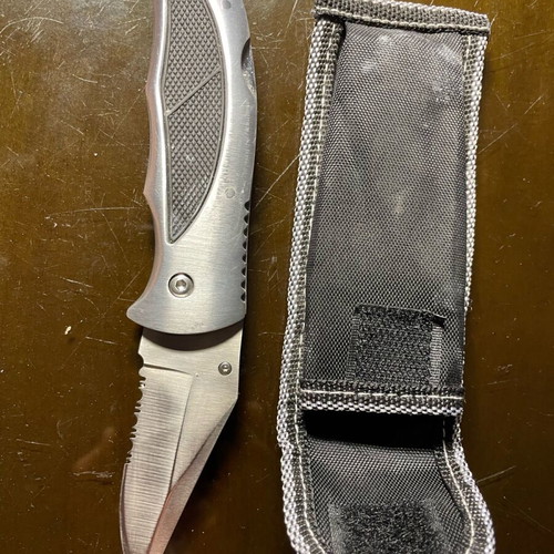 Folding knife with half serrated blade like new