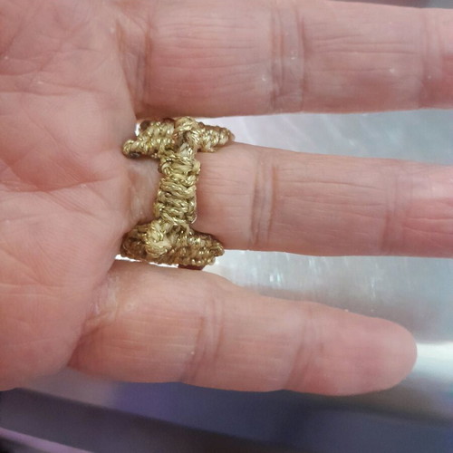 Macrame ring made to order with gold-colored thread and red stones