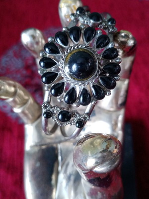 Ethnic cuff bracelet used with black cabochons in rosette shape, silver alloy