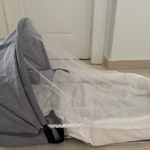Portable travel baby cot with mosquito net new, converts to bag