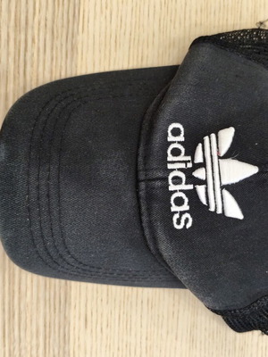 Adidas Originals black trucker cap with white trefoil logo