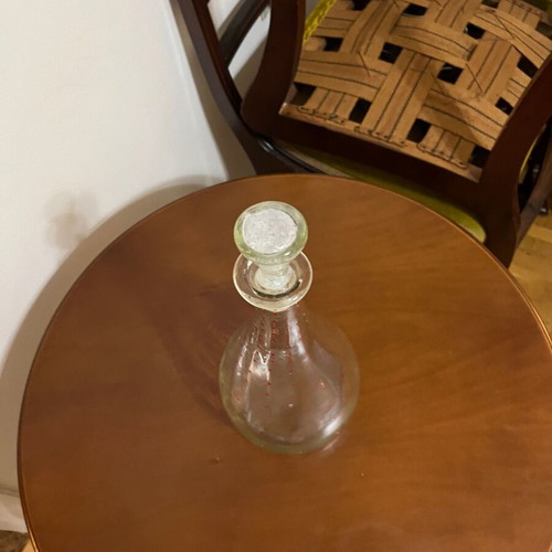 Vintage glass pitcher used with red decorative details