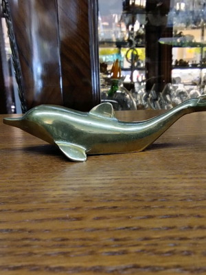 Bronze dolphin bottle opener like new in golden tone