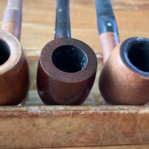 Smoking accessories like new, pipes, stands, pouches and cleaning tools