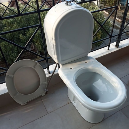 Toilet bowl with cistern like new, siphon outlet to wall