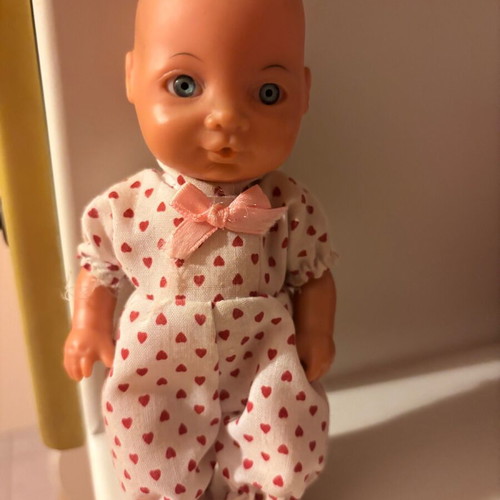 Small baby doll used, approximately 25 cm
