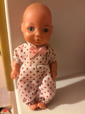 Small baby doll used, approximately 25 cm