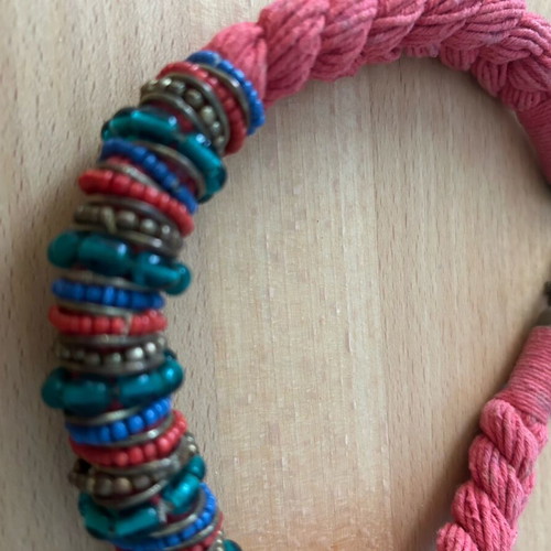 Red braided necklace with multicolored stones used