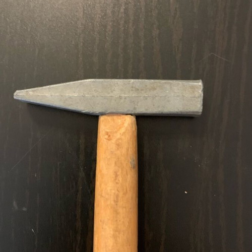 Small hammer used, as shown