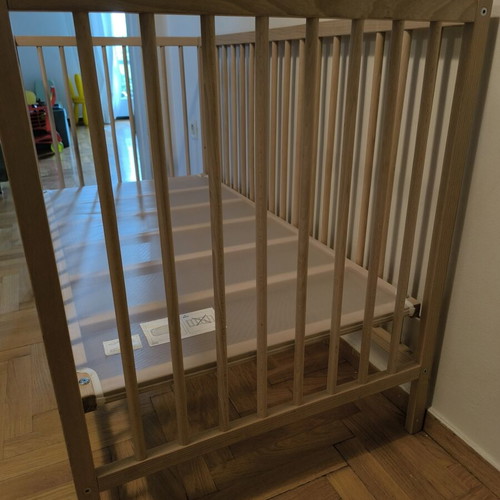 IKEA baby cot with mattress and bedding