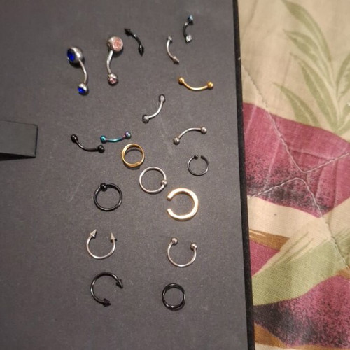 Earrings for navel, eyebrow, and nose in gold, silver, black, and rainbow colors
