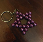 Handmade star keychain with purple pearl beads and metal ring