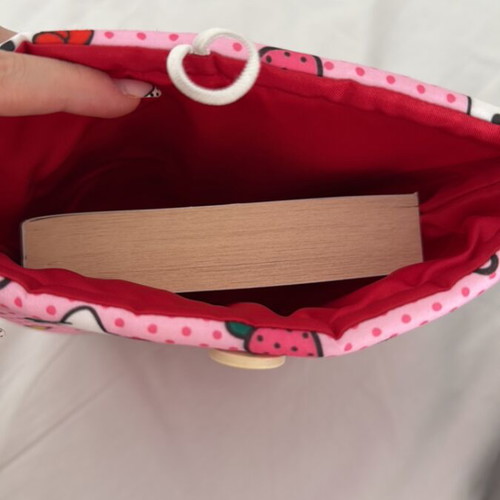 Handmade booksleeve with soft lining and button closure