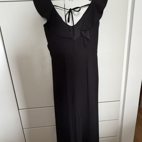 Jumpsuit with ruffles one size like new, black