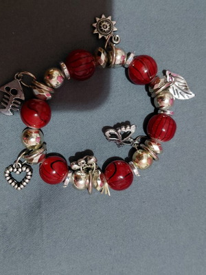 Bracelet, red beads with silver charms