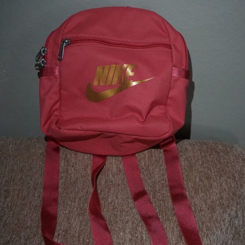 Nike mini backpack like new with gold logo, red