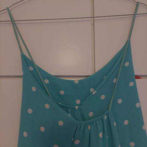 Light blue polka dot dress with crisscross back and side slits