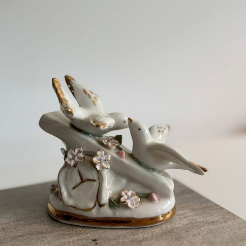 Vintage porcelain figurine of two white doves with gold accents used