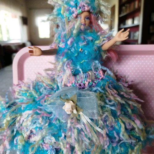 Doll with handmade dress and hat used