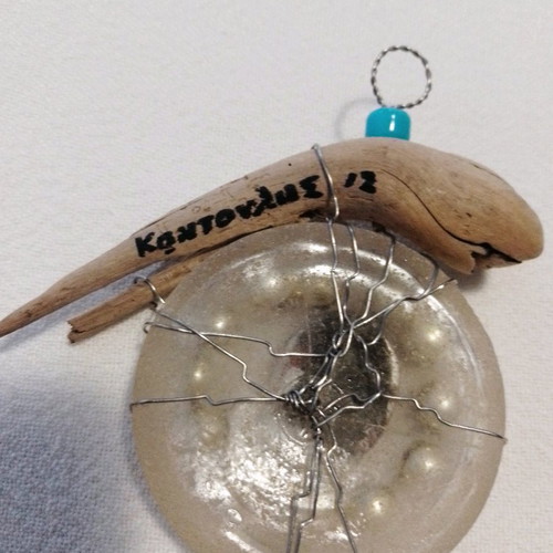 Signed micro-sculpture used, with glass, wood, beads