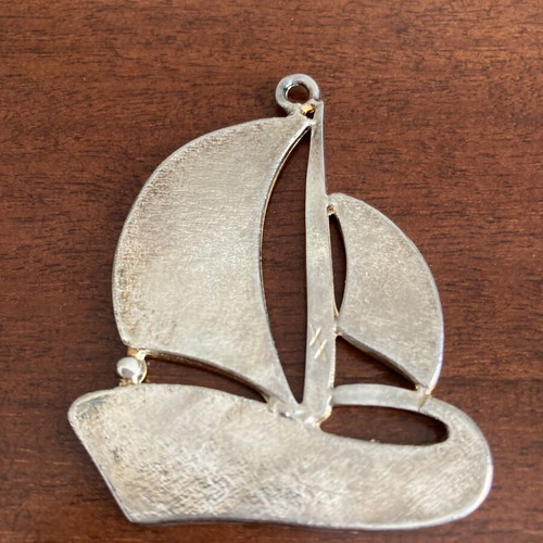 Vintage silver tone sailboat pendant with blue and white enamel