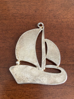 Vintage silver tone sailboat pendant with blue and white enamel
