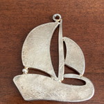 Vintage silver tone sailboat pendant with blue and white enamel