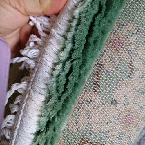 Rug 2.00x3.00 like new with mint-colored almond blossoms