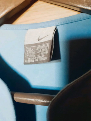 Nike women's turquoise shirt like new, size L/M