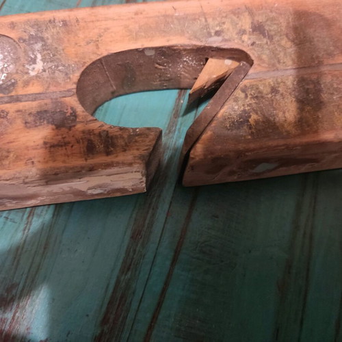Wooden plane used with signs of wear, about 25 centimeters