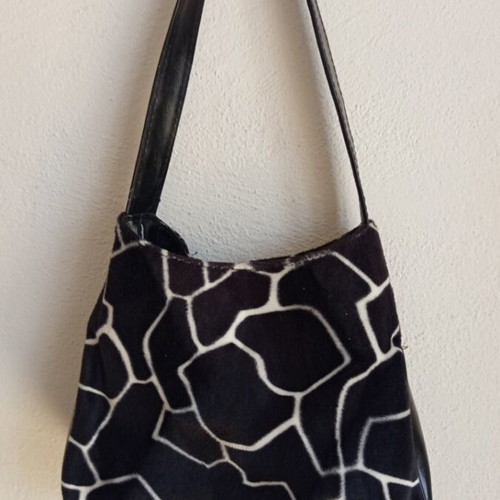 Shoulder bag with animal print giraffe design like new, black and white