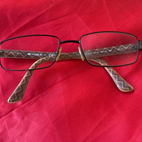 Vogue eyeglass frame like new with black and printed design