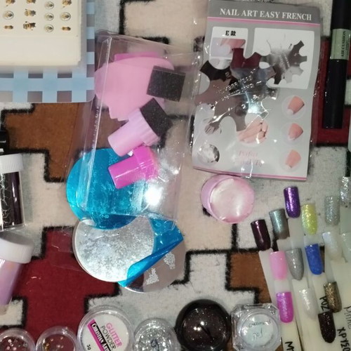 Large nail art set like new with glitter, foil, rhinestones, and decorations