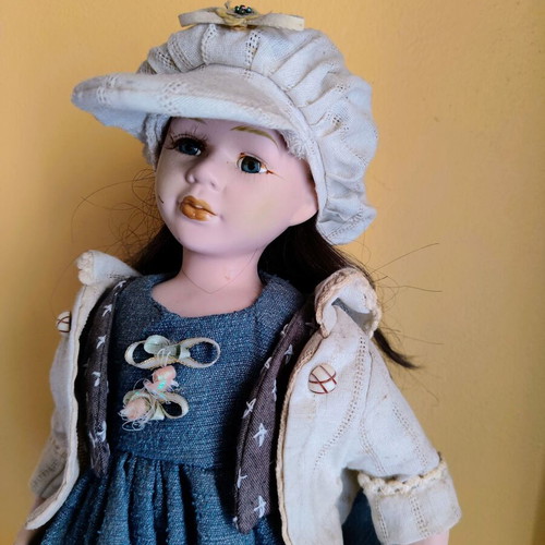 Porcelain doll with stand, 42 cm