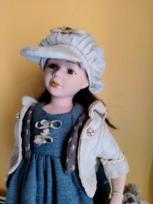 Porcelain doll with stand, 42 cm