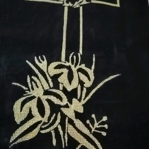 Handmade embroidered cross with gold thread on black velvet canvas
