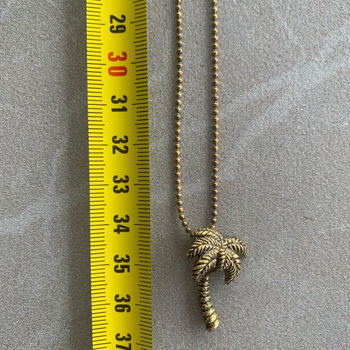 Gold-tone palm tree necklace like new