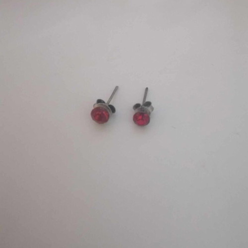 Red earrings used with silver details