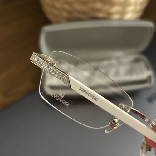 Swarovski women's eyeglasses new, white with crystals