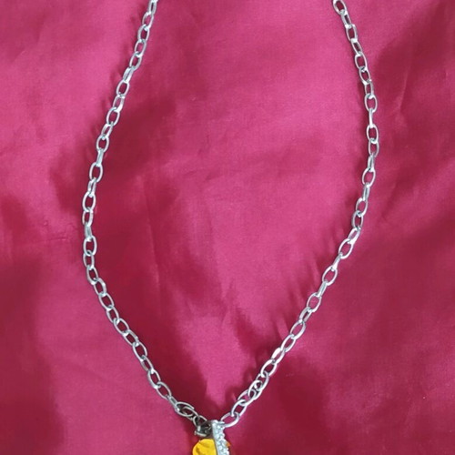 Steel pendant with yellow stone like new