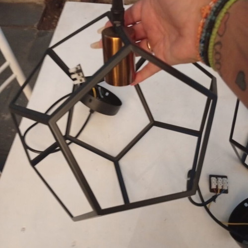 Two rhombic metal ceiling lights