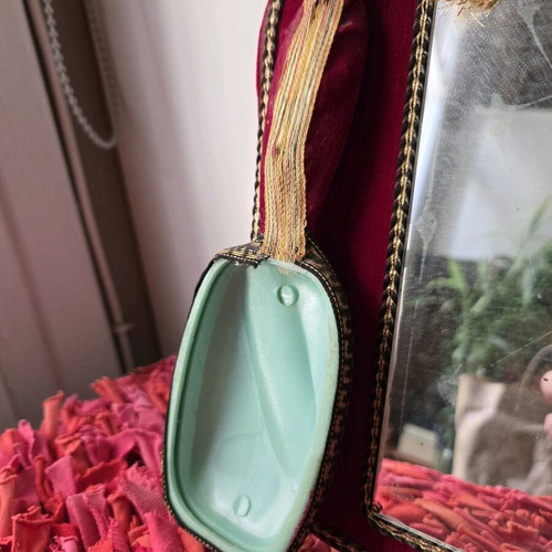 Antique mirror with velvet frame and doll, used 1950-1965