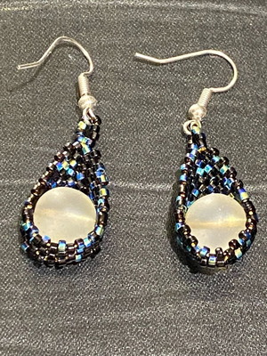 Handmade earrings with black and iridescent beads and white bead, new