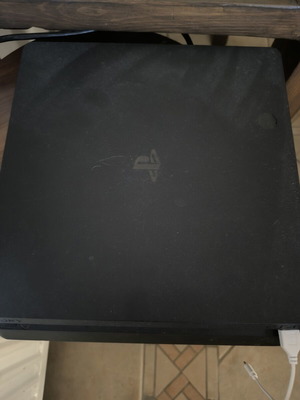 PS4 Slim console like new with 3 games