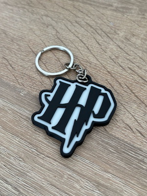 Harry Potter keychain like new, black and white