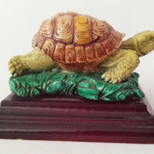 Decorative turtle on wooden base like new