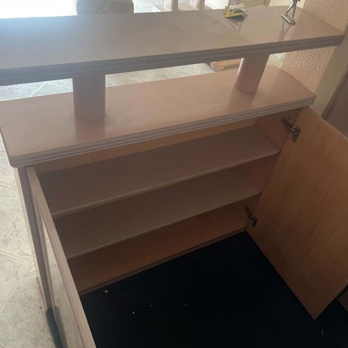 Mini bar like new with mirrors, cabinets, and carpeted floor