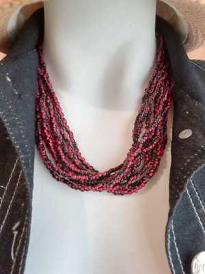 Boho style bronze necklace with small resin beads in burgundy and black