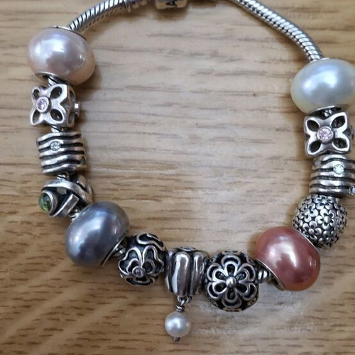 Pandora silver bracelet new with 13 charms
